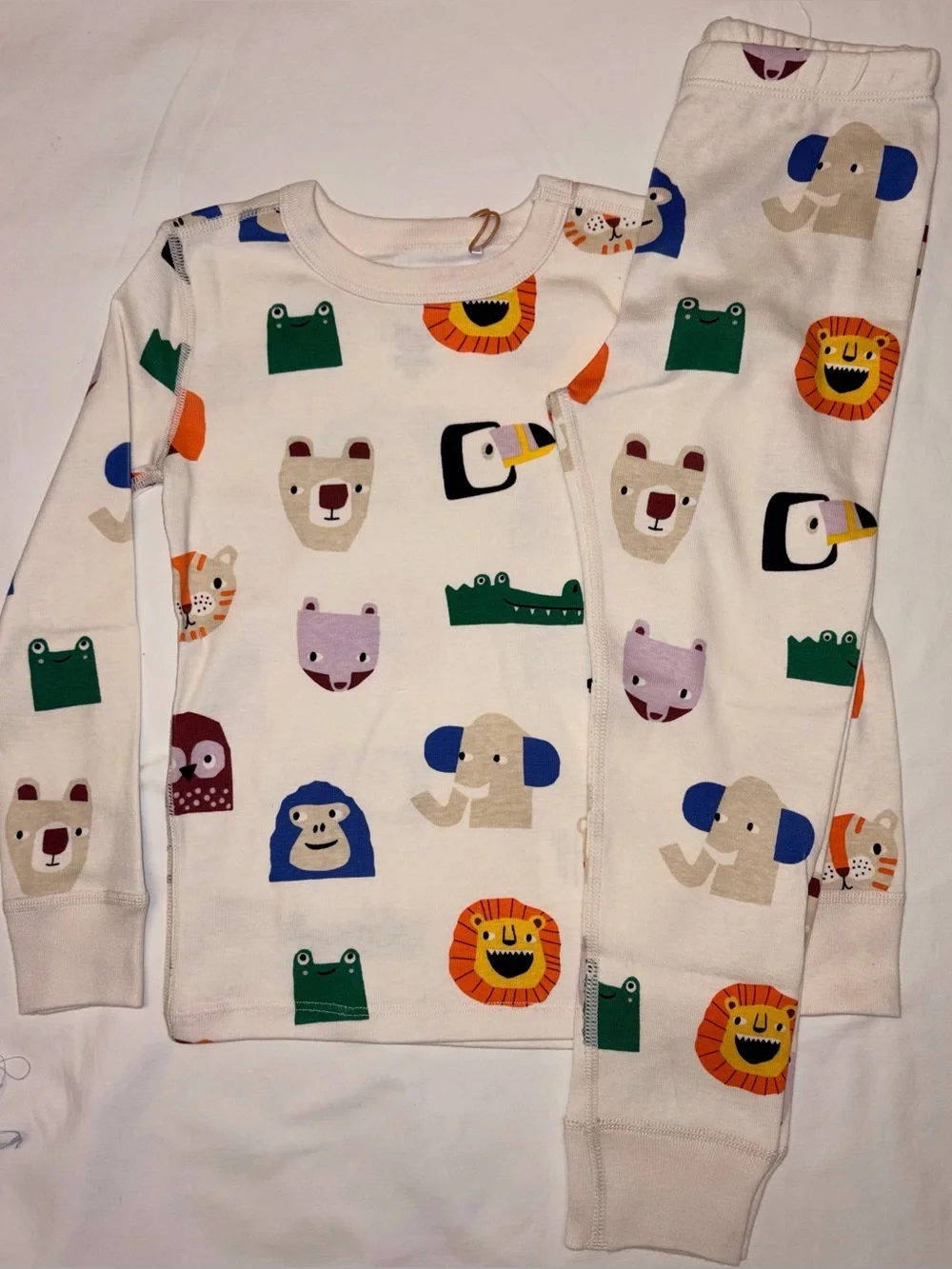 Quince kids unisex pajama set featuring a playful allover animal print sz 4T NWT